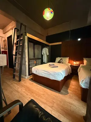 a bedroom with a bunk bed and a ladder at Rent V38 #420 friendly Thailand in Bangkok