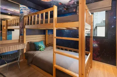 a bunk bed in a room with a star wars mural at Cross Vibe Bangkok Sukhumvit in Bangkok