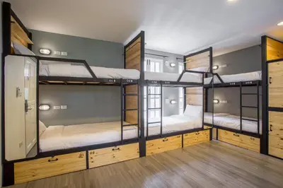 a hostel with four bunk beds in a room at X9Hostel in Bangkok