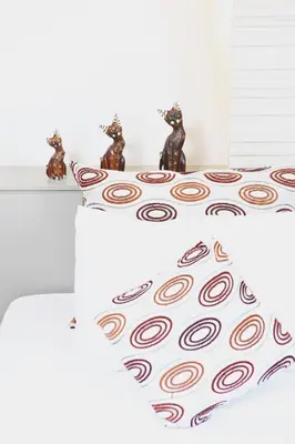 a table with two figurines on top of a table with at Leenova Hotel in Bangkok