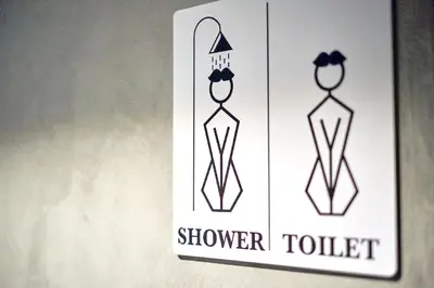a sign for a shower toilet in a bathroom at Narawad Boutique Hotel in Bangkok