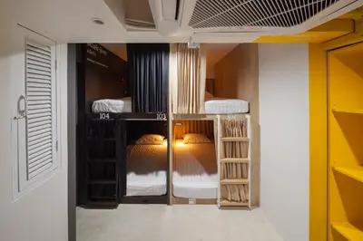 a room with three bunk beds in a room at BoB Hostel บ็อบโฮสเทล in Bangkok