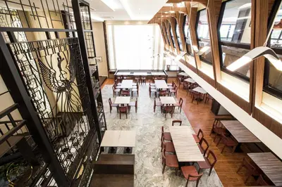 an overhead view of a restaurant with tables and chairs at Villa Baron SHA PLUS in Nonthaburi
