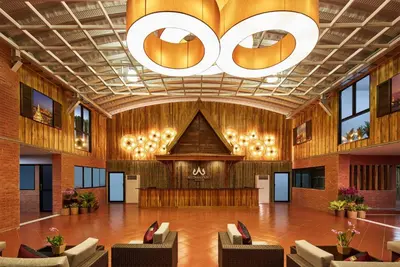 a large lobby with chairs and a large chandelier at Baan Thai Boutique in Bangkok