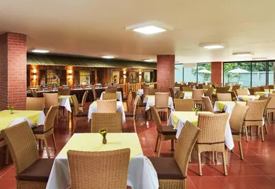 a dining room with tables and chairs in a restaurant at Baan Thai Boutique in Bangkok
