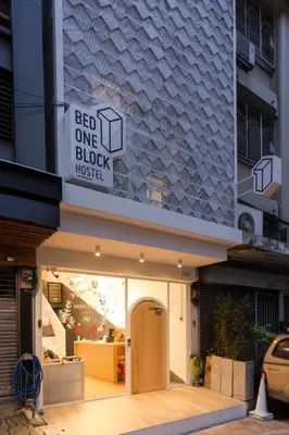 a store front with a sign that reads bee one block master at Bed One Block Hostel in Bangkok