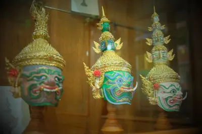 a group of three vases with masks on them at Siri Poshtel Bangkok in Bangkok