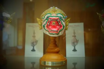 a figurine on a table in a glass case at Siri Poshtel Bangkok in Bangkok