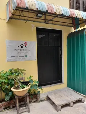 a door to a house with a planter in front of it at Indy house59 in Bangkok