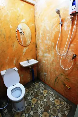 a bathroom with a toilet and a shower at Indy house59 in Bangkok