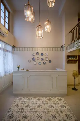 a large room with blue and white plates on the wall at Vera Nidhra - Self check-in after 6pm in Bangkok