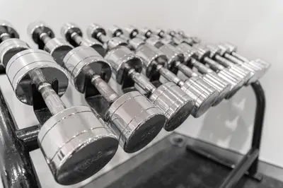 a row of silver knobs on a metal machine at At 115 Hotel By Rompo in Bangkok
