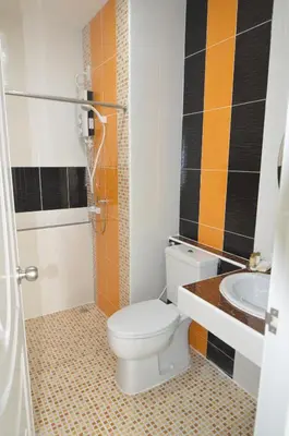 a bathroom with a toilet and a sink at The Best Place in Samutprakarn