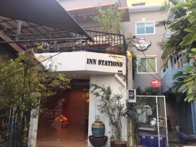 a building with a sign that reads inn stations at Inn Stations Hostel in Bangkok