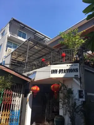 a building with a sign that says im photons on it at Inn Stations Hostel in Bangkok