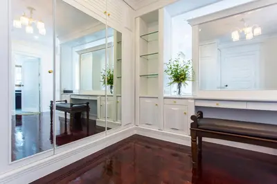 a dressing room with a bench and a mirror at The Lek Aree in Bangkok