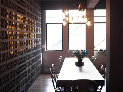 a dining room with a table and chairs at Silom Space Hostel in Bangkok