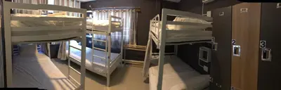 a room with two bunk beds in a room at Mahannop Hostel in Bangkok