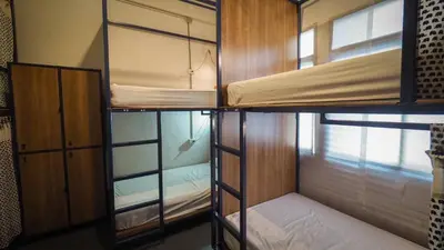 a group of bunk beds in a room at Hoft Hostel Bangkok in Bangkok