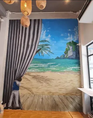 a mural of a beach with a palm tree at Hoft Hostel Bangkok in Bangkok