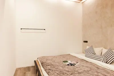 a bedroom with a bed in a room at Vann Bangkok Boutique House in Bangkok