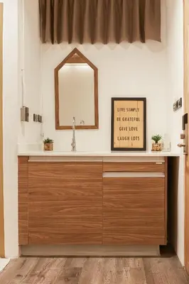 a bathroom with a sink and a mirror at Vann Bangkok Boutique House in Bangkok