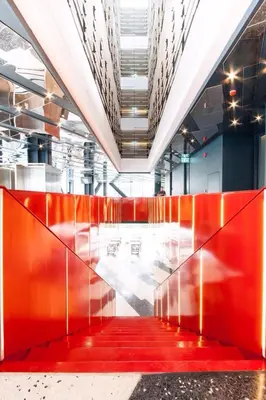 a hallway with red dividers in a building at Klub Hotel Bangkok in Bangkok