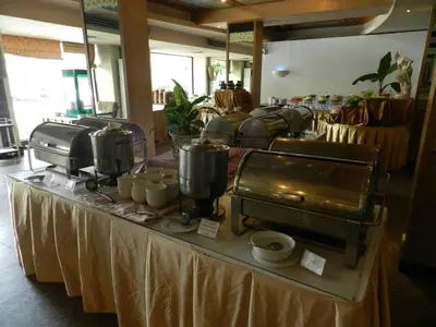 a table with pots and pans on top of it at Niran Grand Hotel in Bangkok
