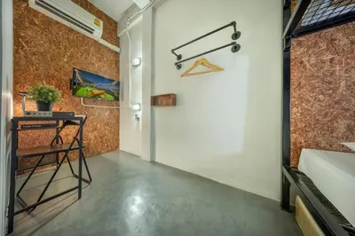 a hallway of a house with a door and a table at RALPH Bangkok in Bangkok