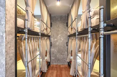 a room with a bunch of bunk beds at Siam Plug In Hostel in Bangkok