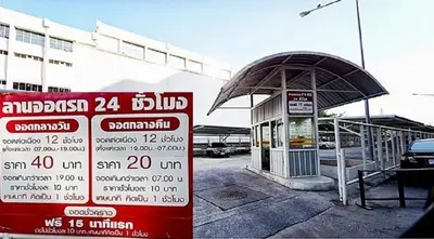 a gas station with a sign in front of it at Popular Condo C4 in Nonthaburi