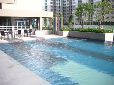 a swimming pool in the middle of a building at Bangkok view in Pinklao in Bangkok
