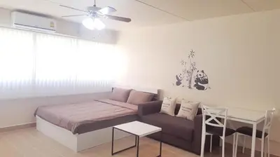 a living room with a couch and a table at Popular Condo P1 in Nonthaburi