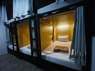 a couple of bunk beds in a room at ORA Hostel Bangkok in Bangkok