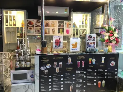 a shop window with a display of drinks and desserts at Top High Airport Link Hotel, Bangkok in Bangkok