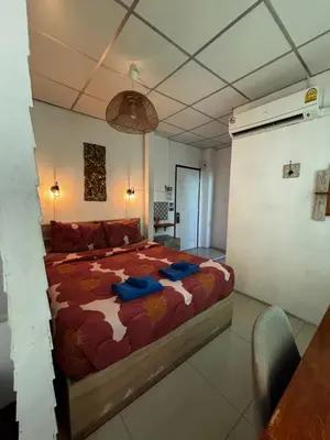 a bedroom with a large bed in a room at La Locanda in Bangkok