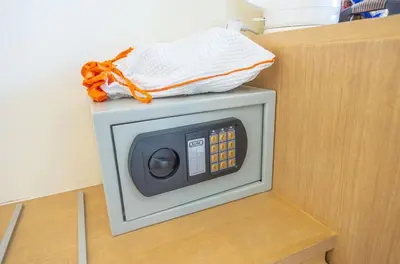 a small microwave sitting on top of a counter at Klean Residence Hotel in Bangkok
