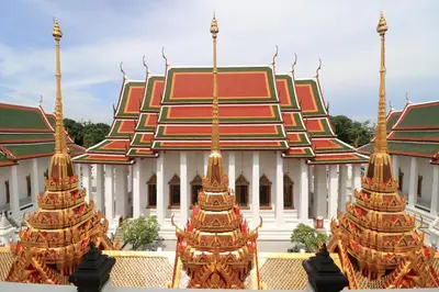 a building with three towers in front of it at Krit Hostel in Bangkok