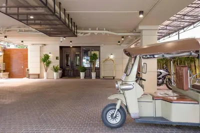 a scooter parked in a room with a building at The LA49 Hotel in Bangkok