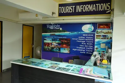 a ticket counter in a building with a sign at Yes Kaosan in Bangkok