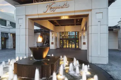 a building with a fountain in front of a building at Siam Kempinski Hotel Bangkok in Bangkok