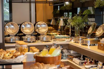 a buffet line with a lot of food on display at Bliston Suwan Park View in Bangkok