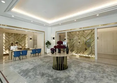a lobby with a table with flowers on it at Bliston Suwan Park View in Bangkok