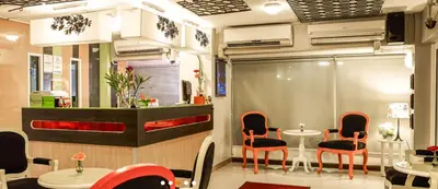 a restaurant with chairs and a table in a room at The Inn Saladaeng in Bangkok