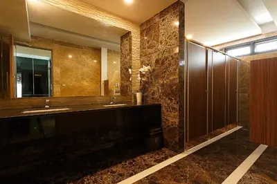 a bathroom with two sinks and a large mirror at Green Point Residence Hotel in Bangkok
