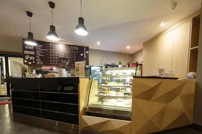 a bakery with a display case in a store at Green Point Residence Hotel in Bangkok