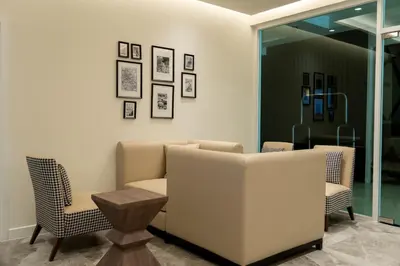 a waiting room with two chairs and a couch at The Legacy Hotel Nana Sukhumvit, Aspira Collection in Bangkok