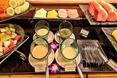 a buffet with different types of food and drinks at Bossotel Bangkok in Bangkok