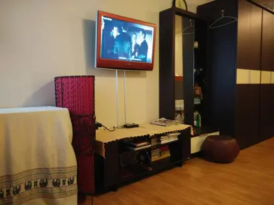 a living room with a tv on the wall at Renovate Room Near Impact in Ban Bang Phang