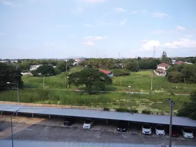 a view of a parking lot with cars parked at Renovate Room Near Impact in Ban Bang Phang